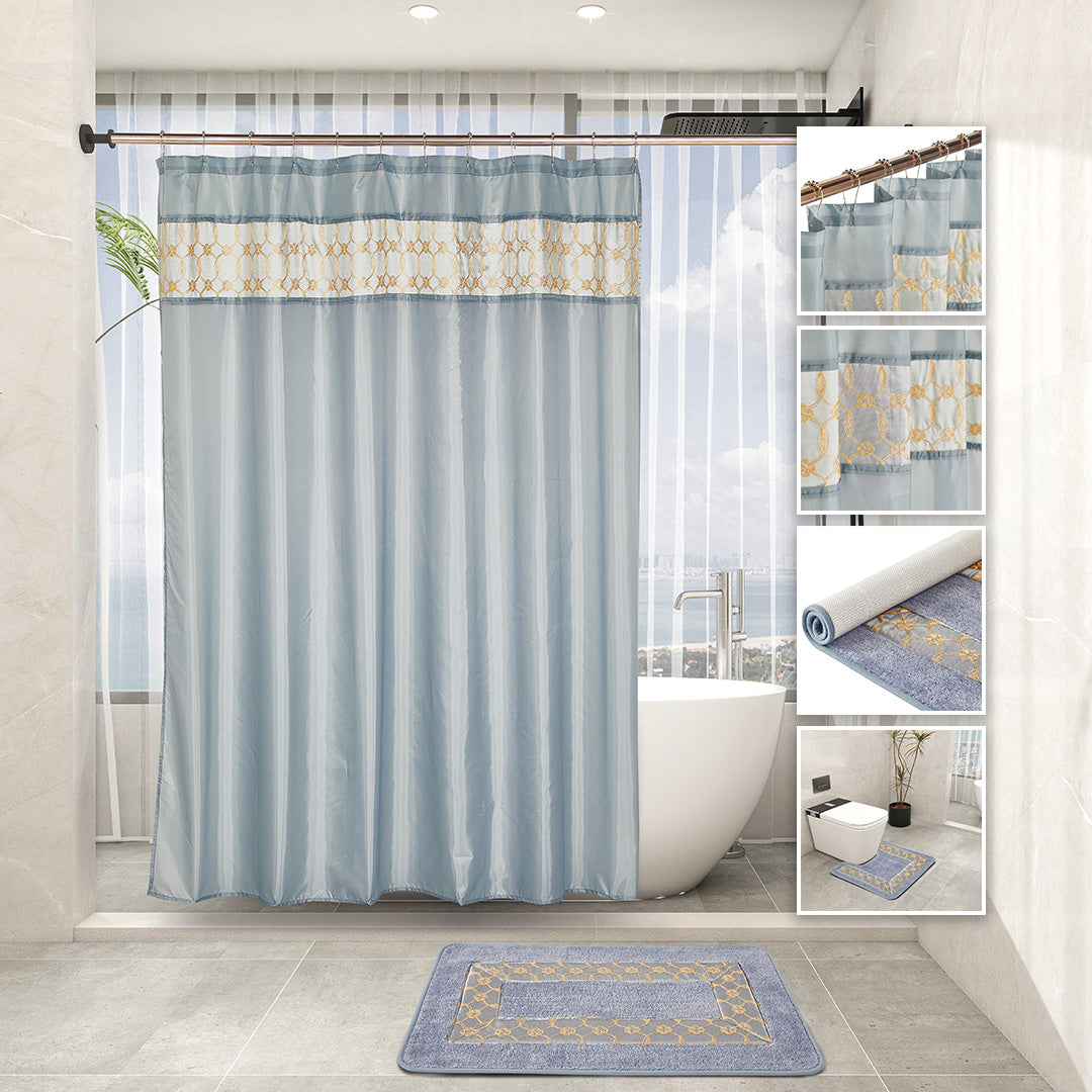 Grey 7-piece bathroom set with embroidered curtain, two non-slip rugs, towel trio, and hooks.
